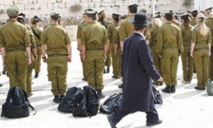 Haredi man walking past soldiers at Kotel. photo courtesy http://failedmessiah.typepad.com