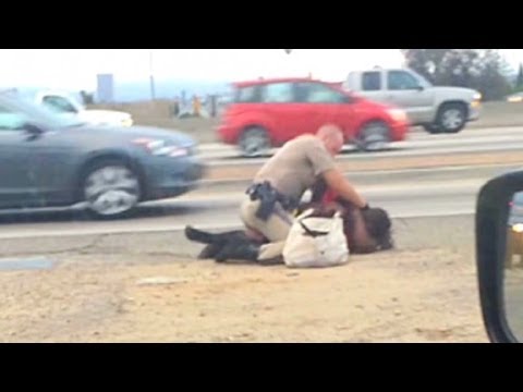 Highway Patrol Officer aims Knockout Punches at Woman along Freeway